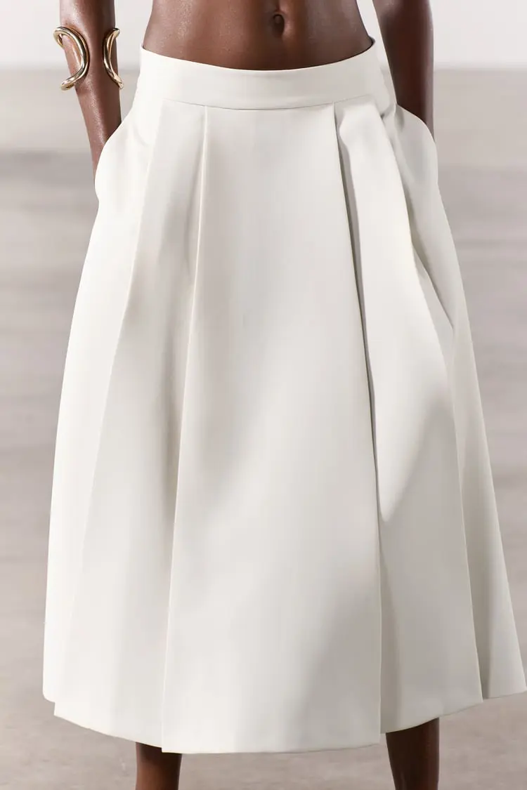 Falda blanca tipo capa