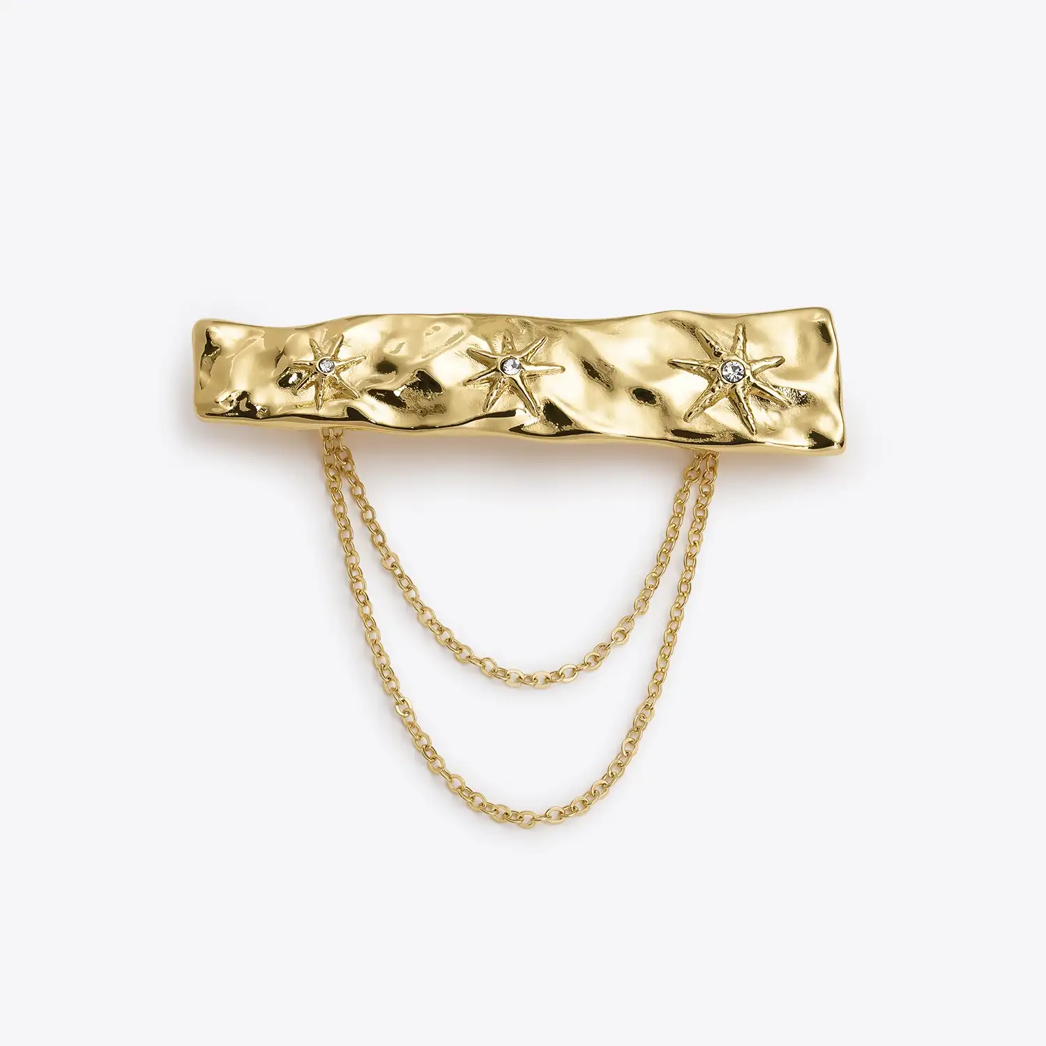 Broche de latón bañado en oro de 25 KT con estrellas compuestas por un cristal black diamond en color gris, de Dosprimeras. Precio: 99€.