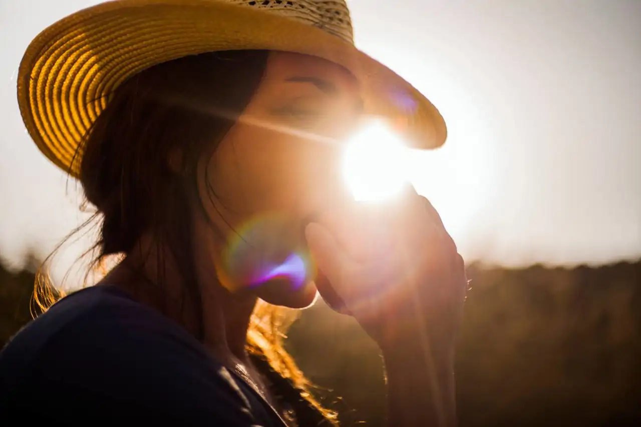 woman eating red apple sunlight 1